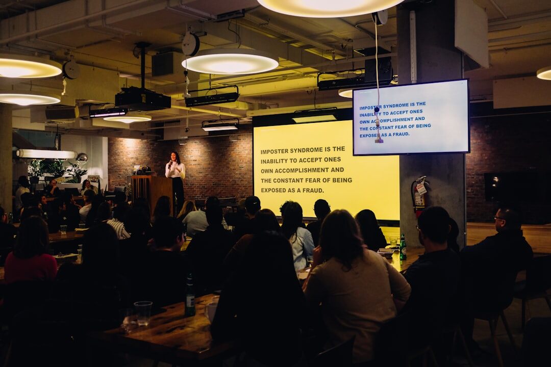 Woman presenting to an audience at a business meetup