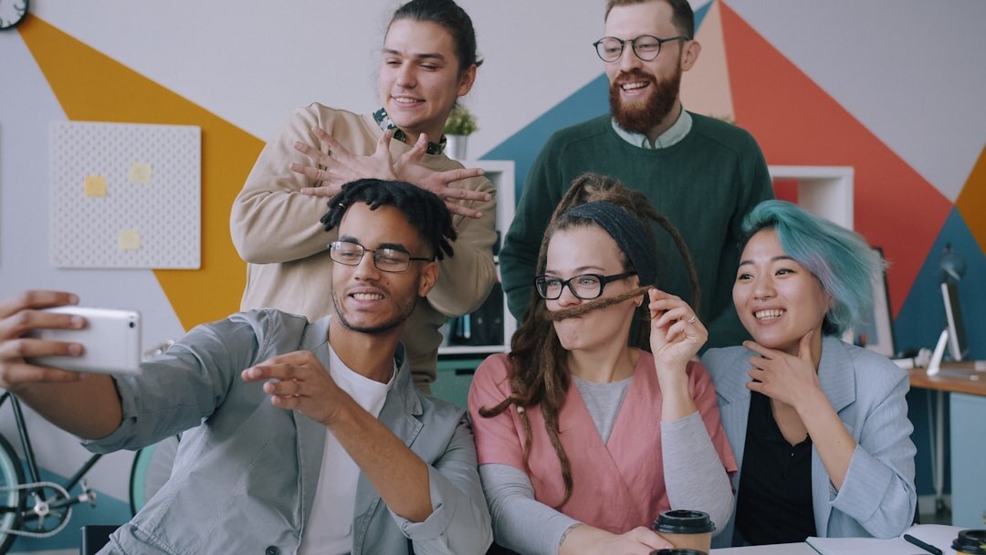 Diverse team of business professionals posing together in an office