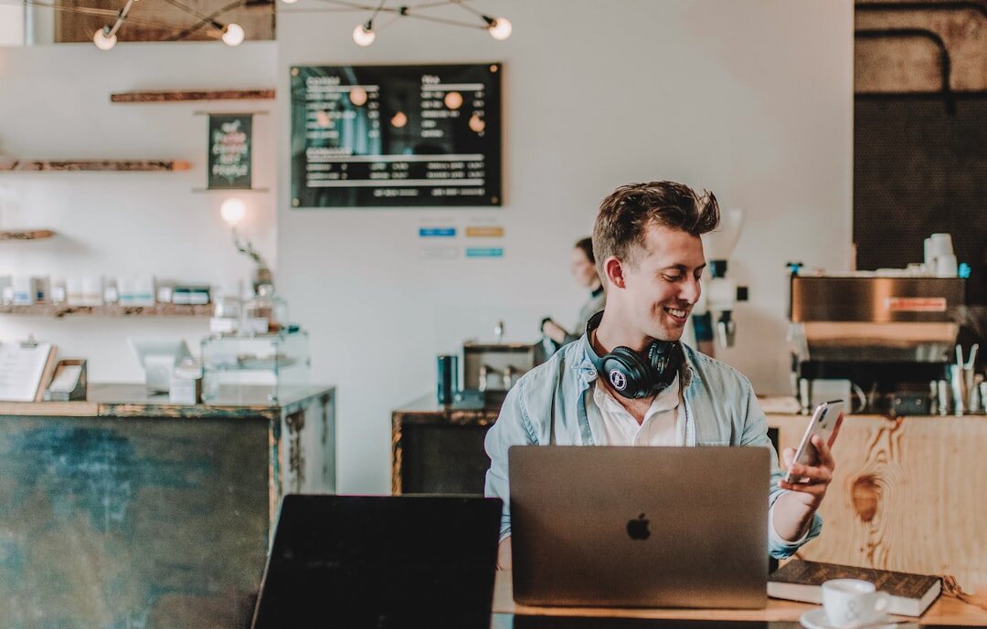 Belgian entrepreneur working on a laptop in a modern office